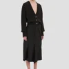 Cardigan con tasche a trecce in nero Cardigan con tasche a trecce in nero