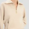 Maglione Milano con mezza zip in rosa pallido Maglione Milano con mezza zip in rosa pallido