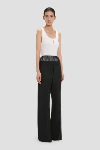 Pantaloni con inserti trasparenti in nero