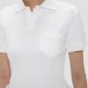 Top con collo a polo in bianco Top con collo a polo in bianco